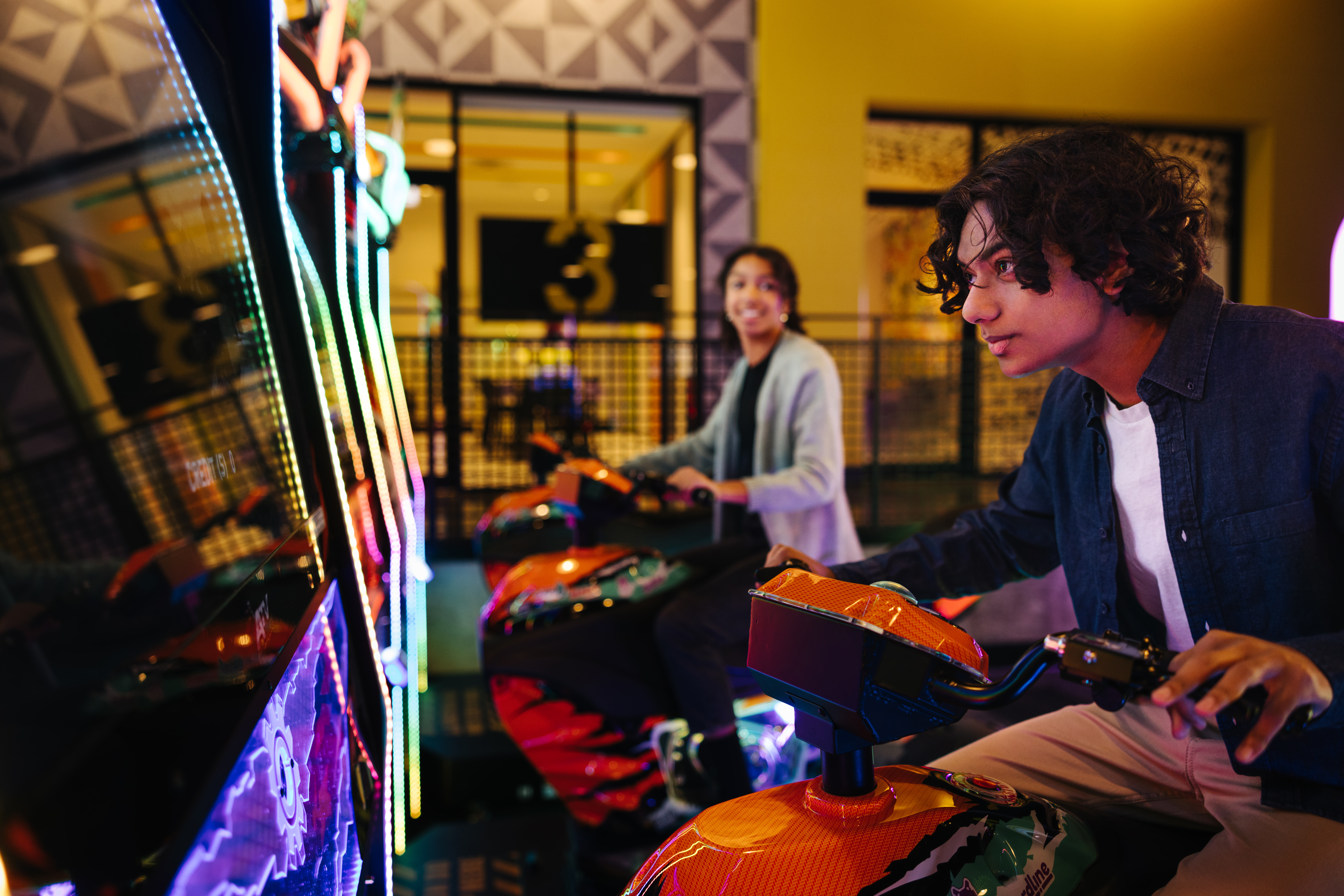 2023-Playdium - Kids playing arcade games Kids playing arcade games at Playdium in Whitby