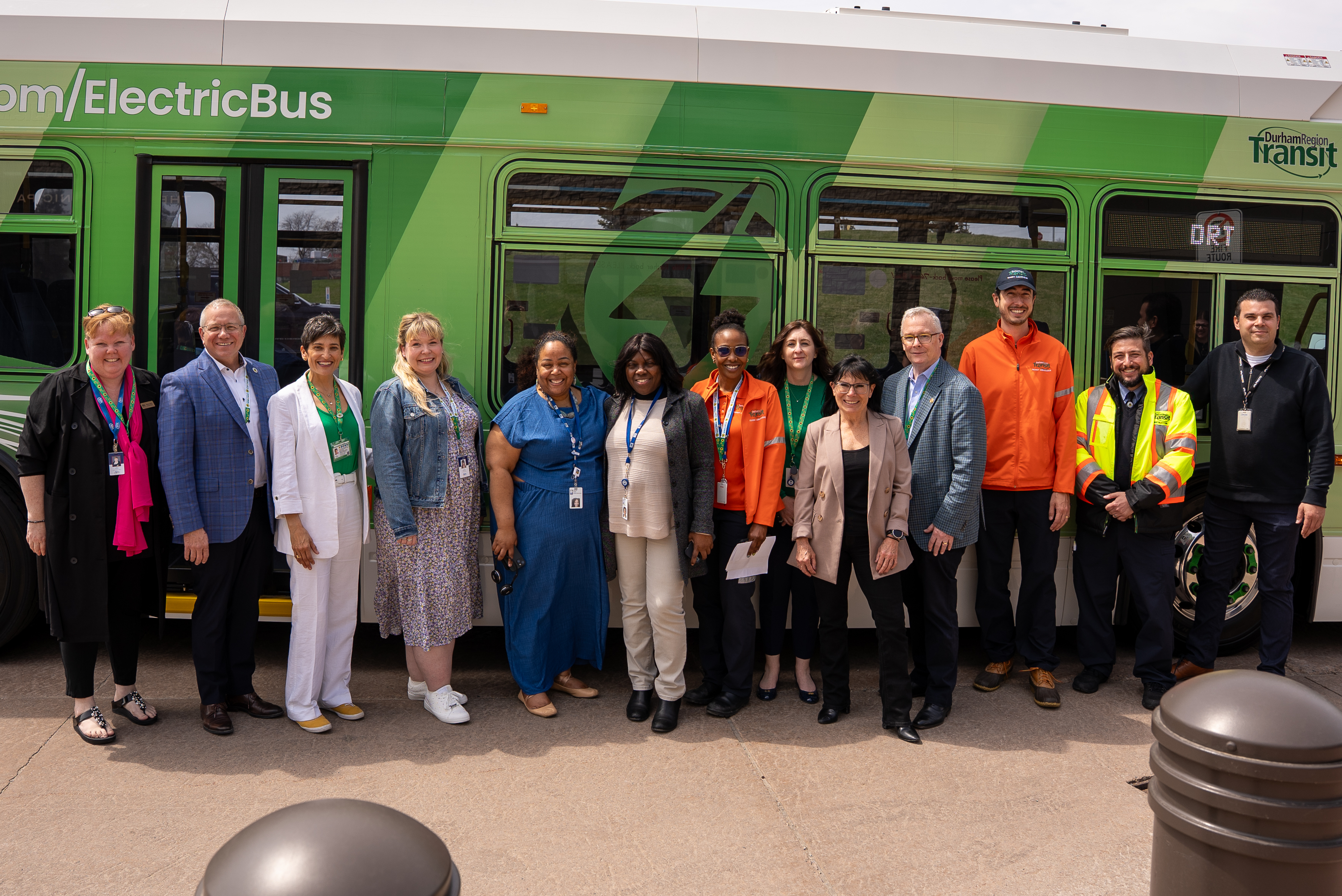 A group of people in front of a bus