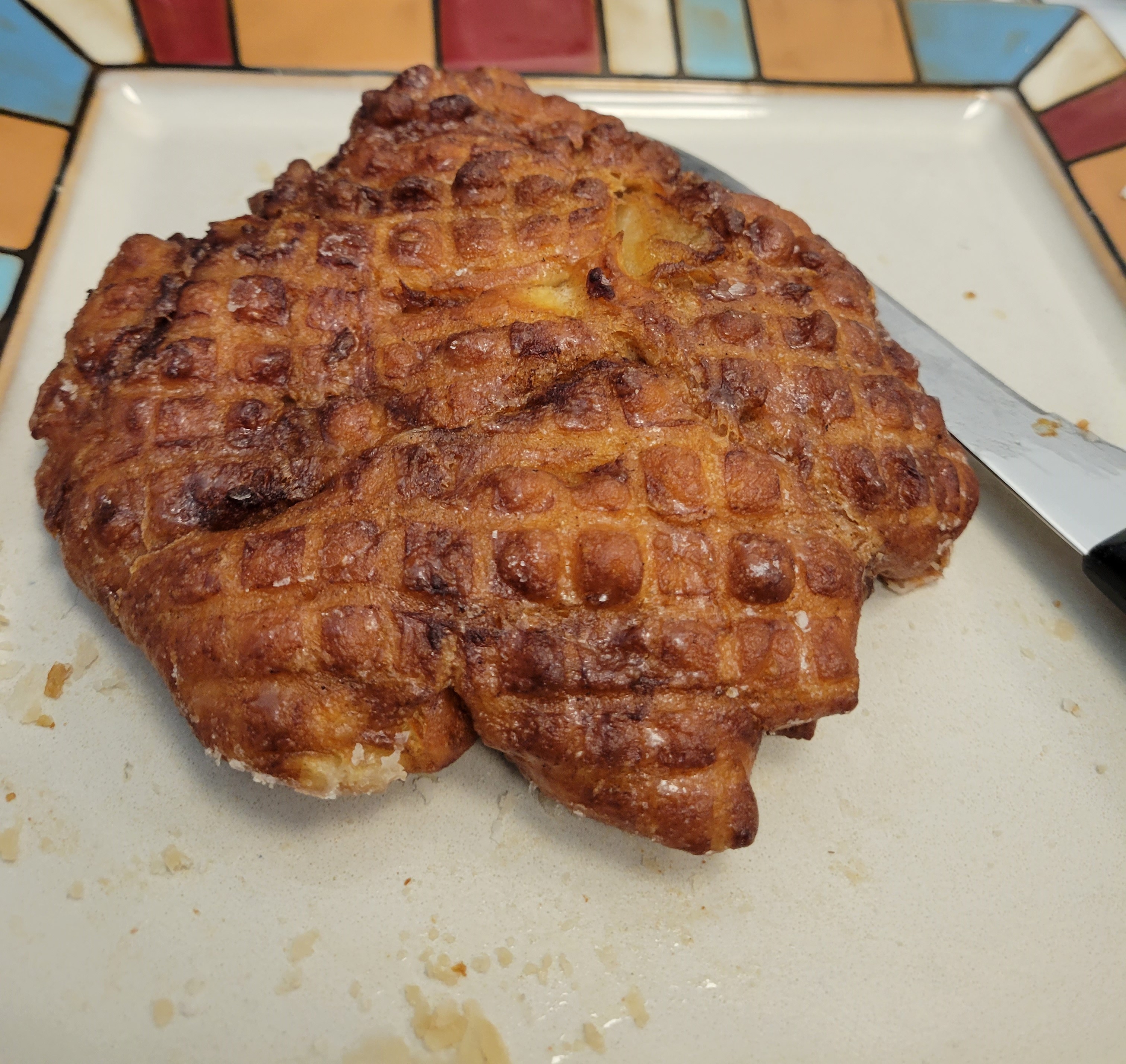 Village Bake Shop apple fritter Village Bake Shop apple fritter on colourful plate