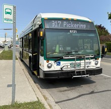 DRT bus by a bus stop