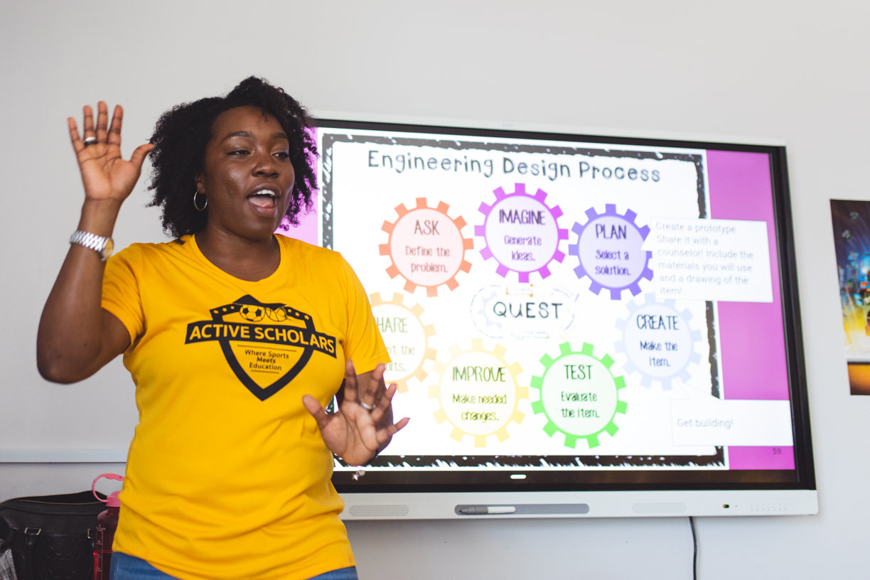 Woman teaching a classroom of children