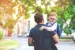 Father and son walking to preschool 
