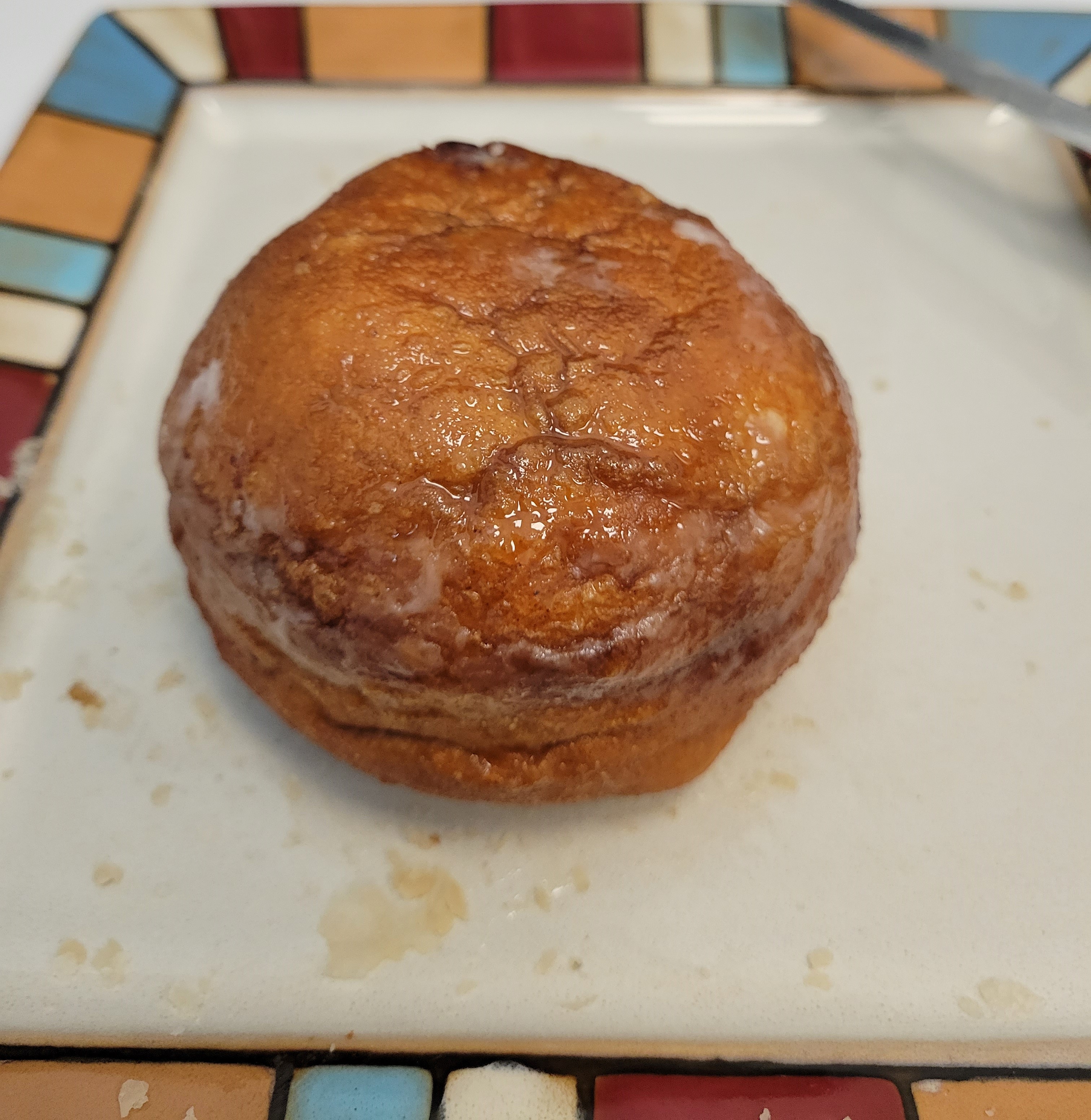 White Feather apple fritter White Feather apple fritter on a colourful plate