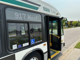 DRT bus by a sidewalk