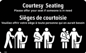 A black courtesy seating sign with white text